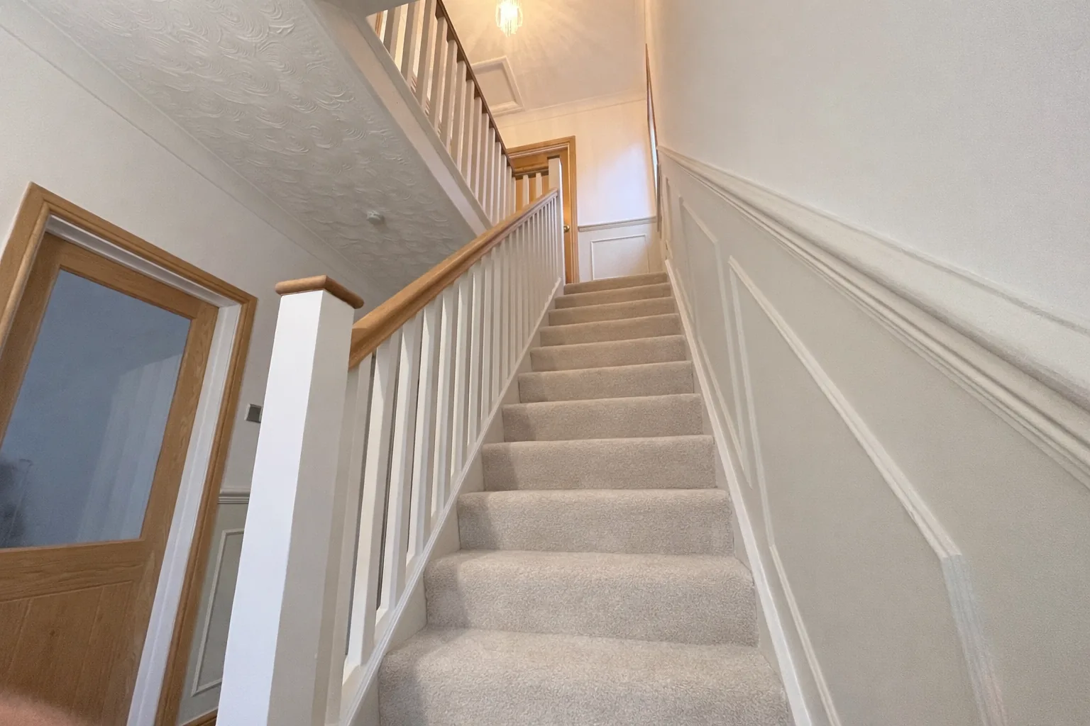 Bespoke oak banister stair refurbishment by LM Carpentry in Neath Port Talbot