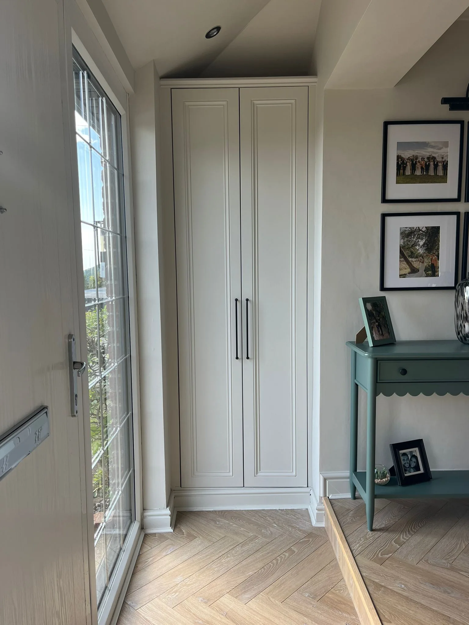 Cream floor-to-ceiling fitted wardrobes in hallway in Neath