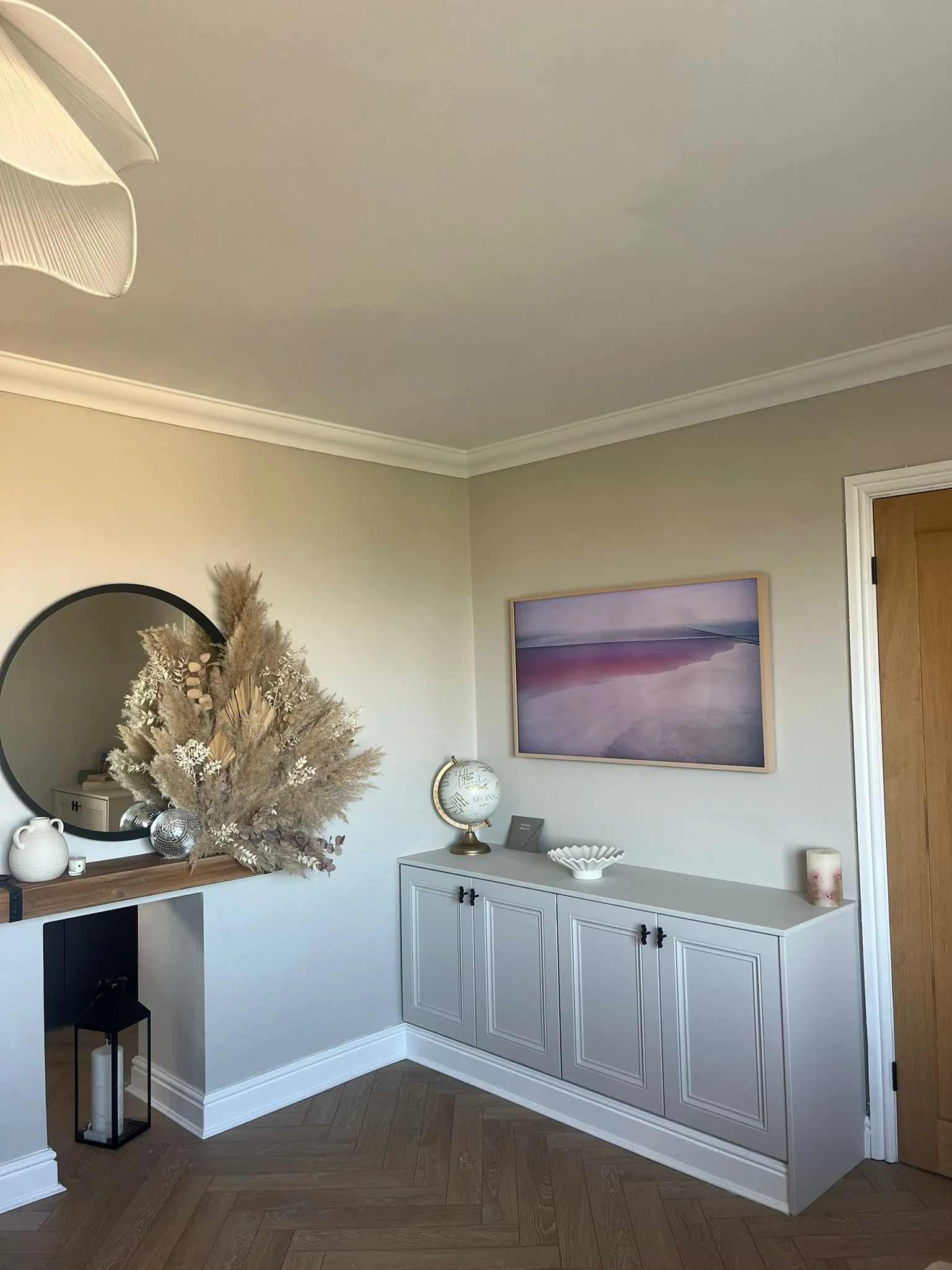 Grey shaker style cabinetry sideboard with herringbone floor