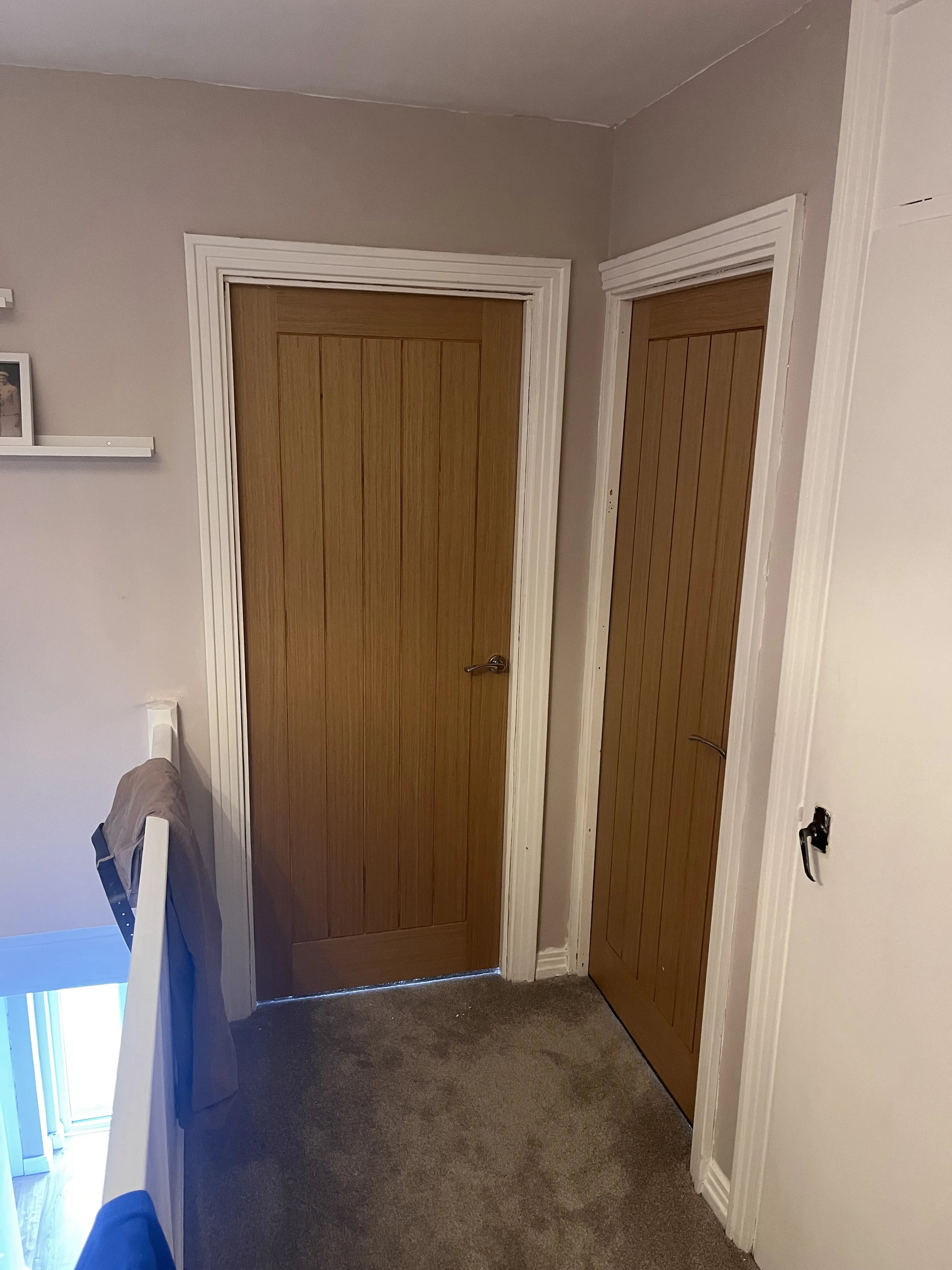 Two oak internal doors fitted on a landing in Neath Port Talbot