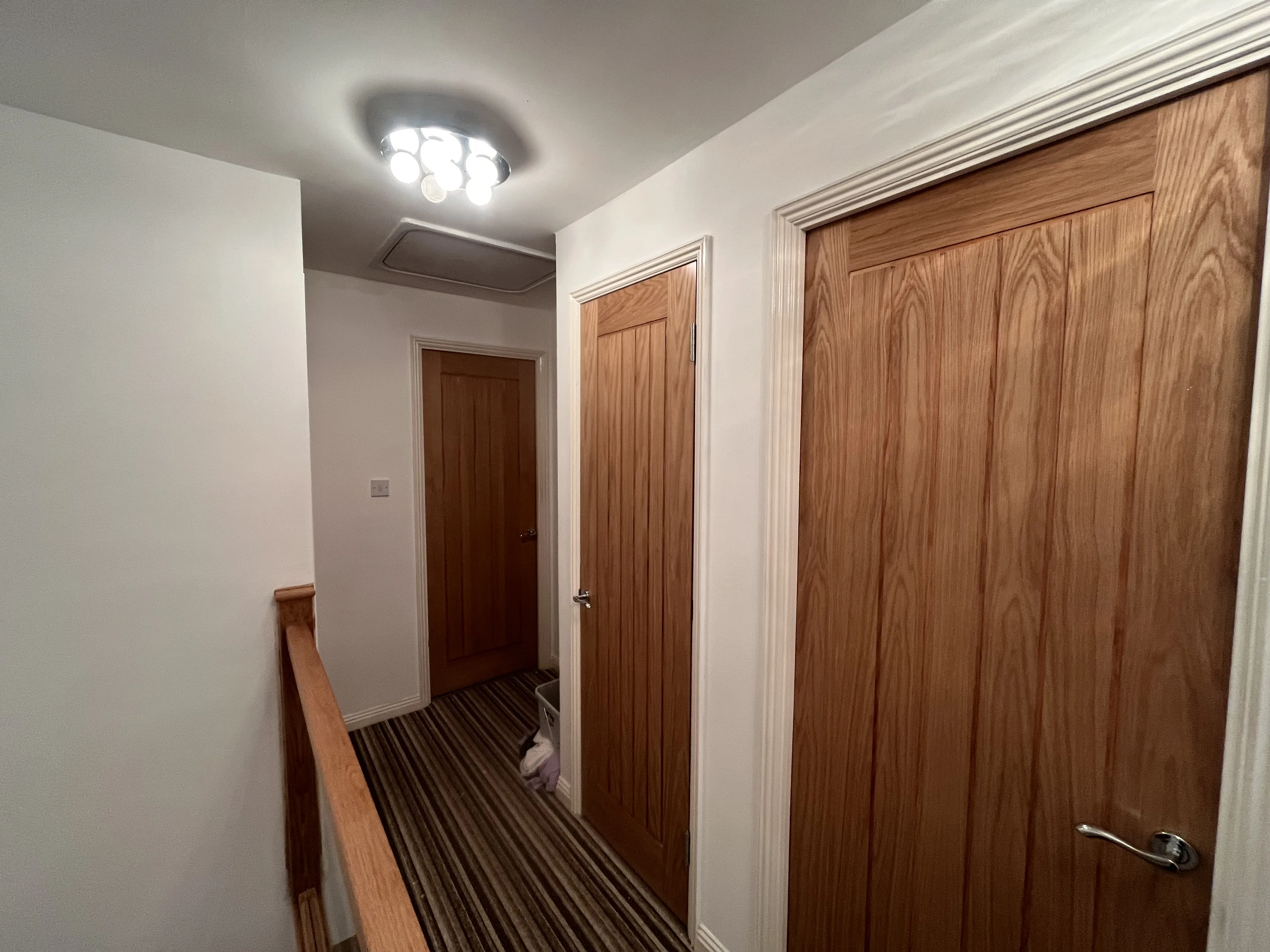 Oak internal doors along a landing in Neath Port Talbot