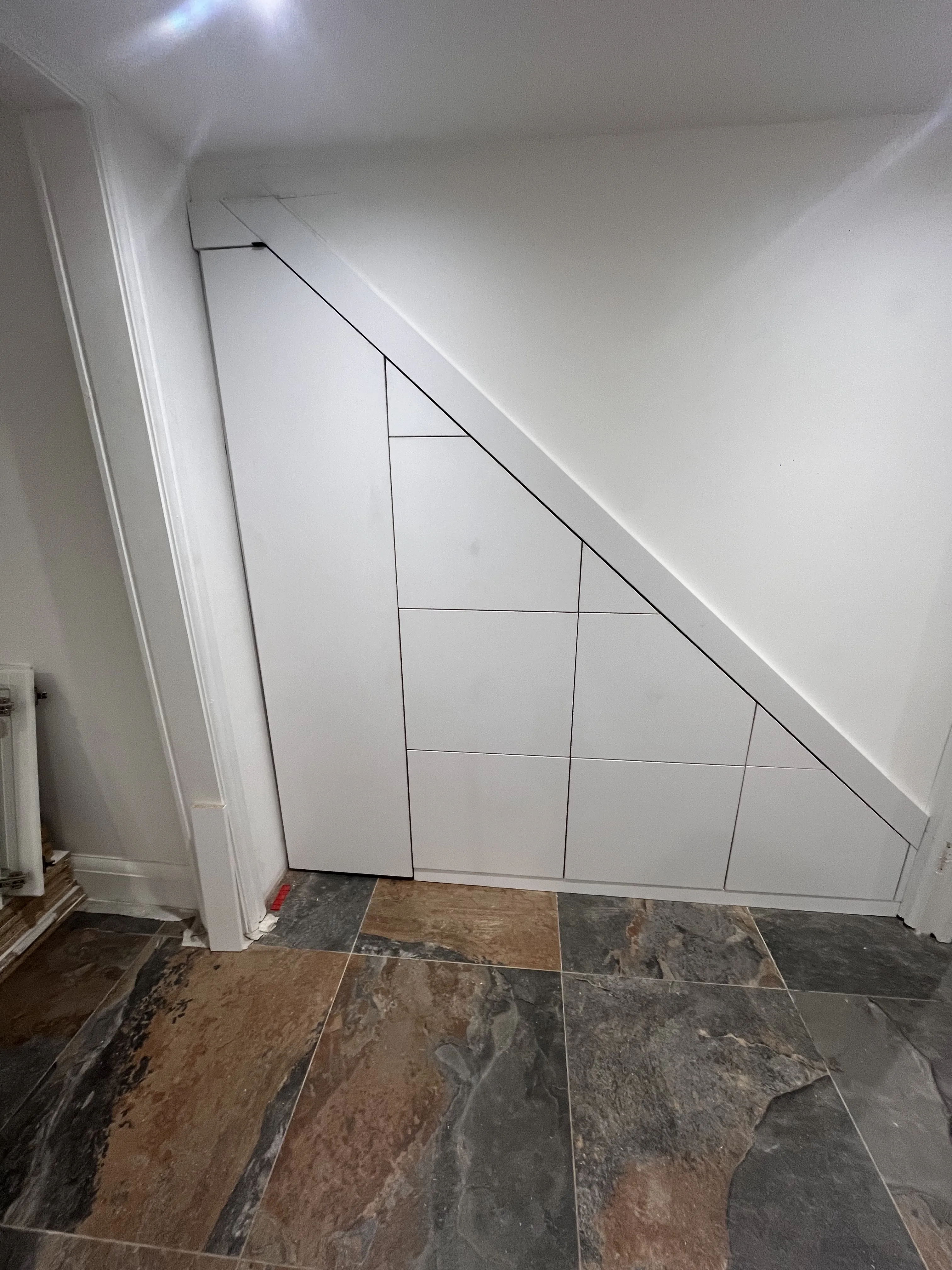 Bespoke under stairs cupboards with handleless design